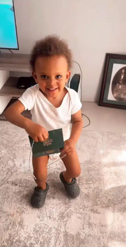  Omoshola shares video of his son's reaction after receiving His Nigerian passport
