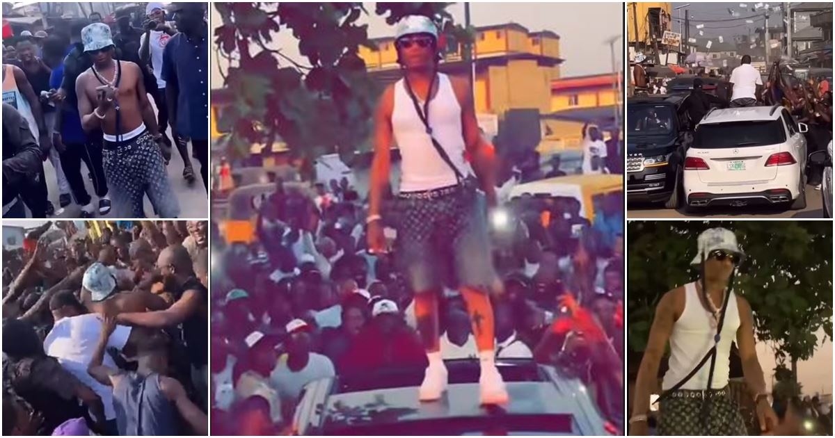 Videos as Wizkid storms Surulere, causes unrest with random money spray, fans go gaga