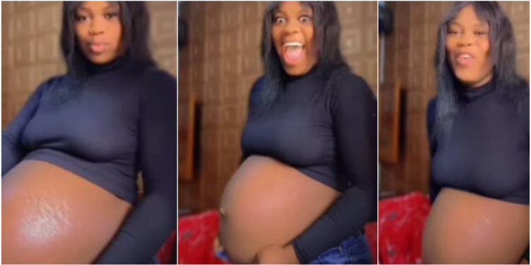 Pregnant lady playfully alters her enlarged bump