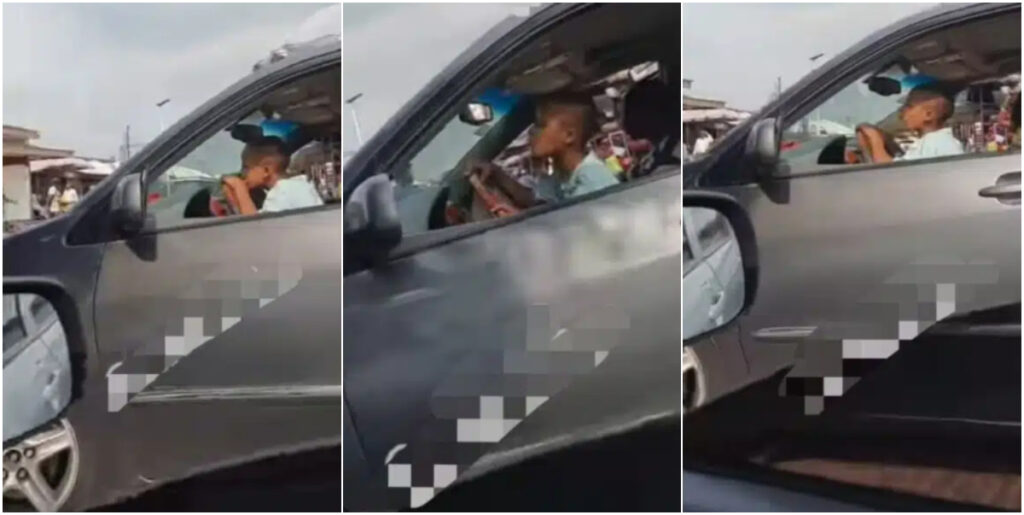 Video emerges of little child expertly steering a car in busy Abuja Market