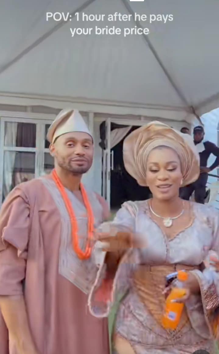 Moment bride playfully claims husband at traditional wedding ceremony