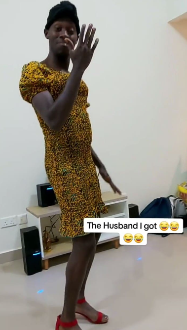 Man surprises his wife by dancing in her gown and heels