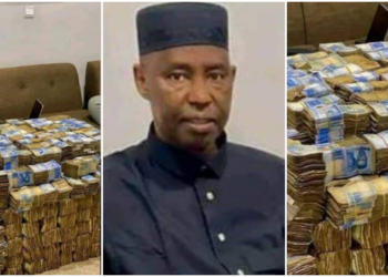 Viral photo shows Nigerian politician with stacks of cash in apartment