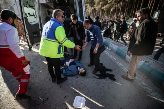 Iranian emergency services arrive at the site where two explosions in quick succession struck a crowd marking the anniversary of the 2020 killing of Guards general Qasem Soleimani, near the Saheb al-Zaman Mosque in the southern Iranian city of Kerman on January 3, 2024. - The blasts, which state television called a "terrorist attack", came with tensions running high in the Middle East a day after Hamas number two was killed in a Beirut drone strike. The blasts stuck near the Saheb al-Zaman Mosque in Kerman, Soleimani's southern hometown where he is buried, as supporters gathered to mark the fourth anniversary of his death in a US drone strike just outside Baghdad airport. (Photo by MEHR NEWS / AFP)