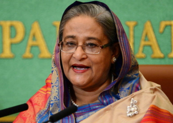 (FILES) Bangladesh Prime Minister Sheikh Hasina speaks at Japan's national press club in Tokyo on May 28, 2014. - Cheering protesters stormed Bangladeshi Prime Minister Sheikh Hasina's palace on August 5, 2024, after she fled, the culmination of more than a month of deadly anti-government protests. (Photo by YOSHIKAZU TSUNO / AFP)