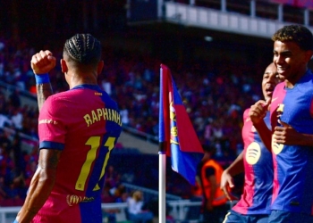 Barcelona's Brazilian forward #11 Raphinha celebrates scoring his team's first goal with Barcelona's Spanish forward #19 Lamine Yamal during the Spanish league football match between FC Barcelona and Real Valladolid FC at the Estadi Olimpic Lluis Companys in Barcelona on August 31, 2024. (Photo by MANU QUINTERO / AFP)