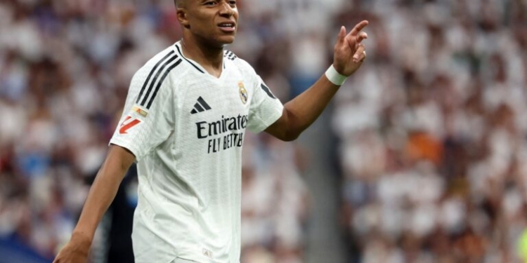 Real Madrid's French forward #09 Kylian Mbappe reacts during the Spanish league football match between Real Madrid CF and Real Valladolid FC at the Santiago Bernabeu stadium in Madrid on August 25, 2024. (Photo by Pierre-Philippe MARCOU / AFP)