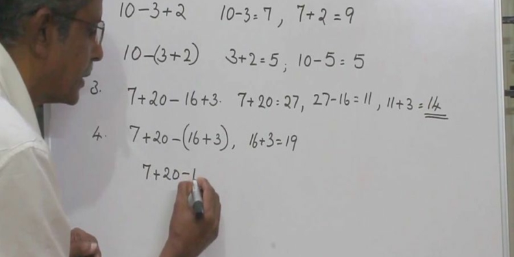 A man solving a mathematical equation