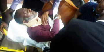 Olisa Metuh on a stretcher in court.