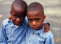 Brothers Arm in Arm --- Image by © Royalty-Free/Corbis