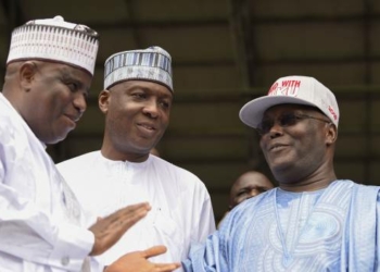 Former Nigerian vice-President Atiku Abubakar (R) is congratulated by runners-up Sokoto State Governor Aminu Tambuwal (L) and Senate President Bukola Saraki (C) after winning the presidential ticket of the opposition People's Democratic Party (PDP) during the party's national convention in Port Harcourt, Rivers State on October 7, 2018. - Nigeria's main opposition Peoples Democratic Party (PDP) has picked Abubakar to challenge President Muhammadu Buhari who is seeking a second term in presidential polls scheduled for February 2019. (Photo by PIUS UTOMI EKPEI / AFP)        (Photo credit should read PIUS UTOMI EKPEI/AFP/Getty Images)