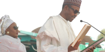 PRESIDENT MUHAMMADU BUHARI BEING SWORN IN BY THE CHIEF JUSTICE OF THE FEDERATION, JUSTICE MAHMUD MOHAMMED IN ABUJA