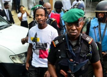 Naira Marley heavily guarded by Police