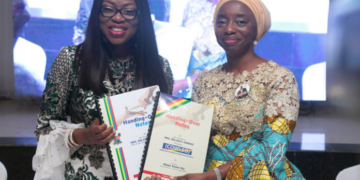 Wife of the Governor of Lagos State and chairman, Committee of Wives of Lagos State Officials (COWLSO), Mrs Bolanle Ambode (L) and wife of the Governor-elect, Dr. (Mrs.) Ibijoke Sanwo-Olu (R), displaying the handing-over documents after signing, during the handing-over ceremony wife of the in-coming governor, at the Lagos House, Alausa, Ikeja, over the weekend.