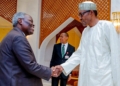 Pastor Kumuyi and President Buhari exchanging pleasantries