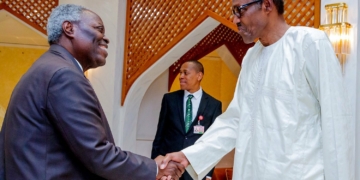 Pastor Kumuyi and President Buhari exchanging pleasantries