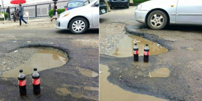 potholes on Lagos road with coke drink