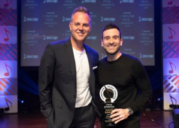 David Garcia holding his award