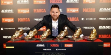 Lionel Messi display his  golden Shoe