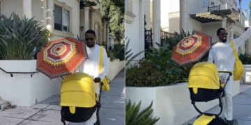 D’banj taking a walk with his new born