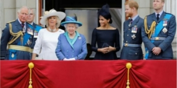 L-R Senior royals including Harry’s father Prince Charles,  Meghan and Harry