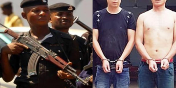 Nigerian policemen, depict of arrested Chinese men