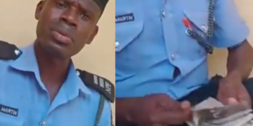 VIDEO: Police officer caught on video counting money after "extorting" 40,000 from a man has been arrested