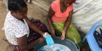 Photos: Mozambican women caught washing used facemasks to resell