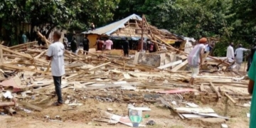 PHOTOS: FCT authorities demolish popular brothel as sex workers watch in agony