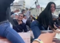 Woman twerks on top of half-opened coffin as funeral takes strange turn