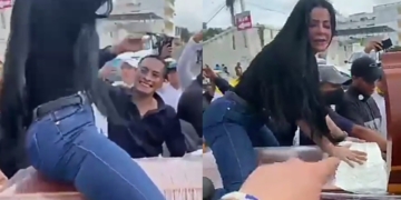 Woman twerks on top of half-opened coffin as funeral takes strange turn